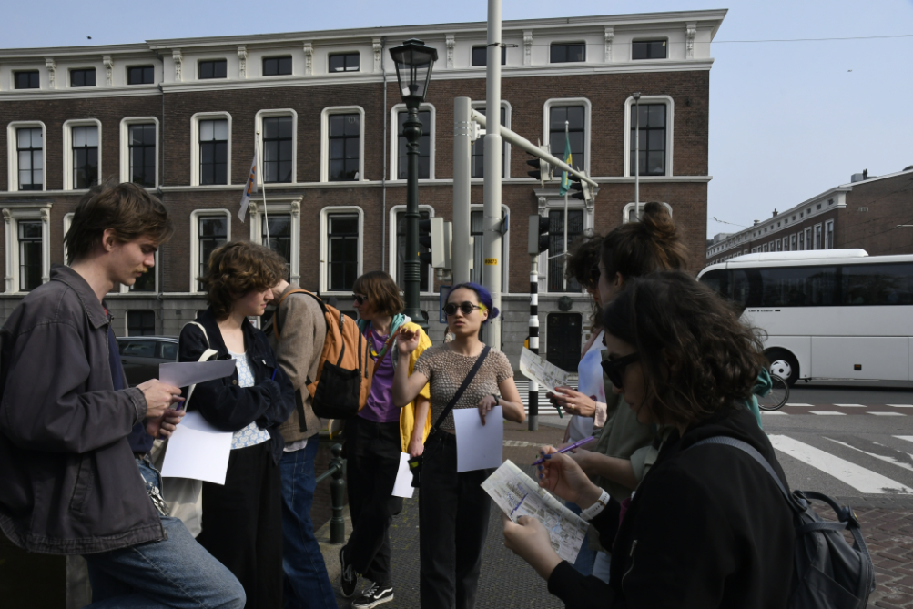 group listening to one of the two artists style=