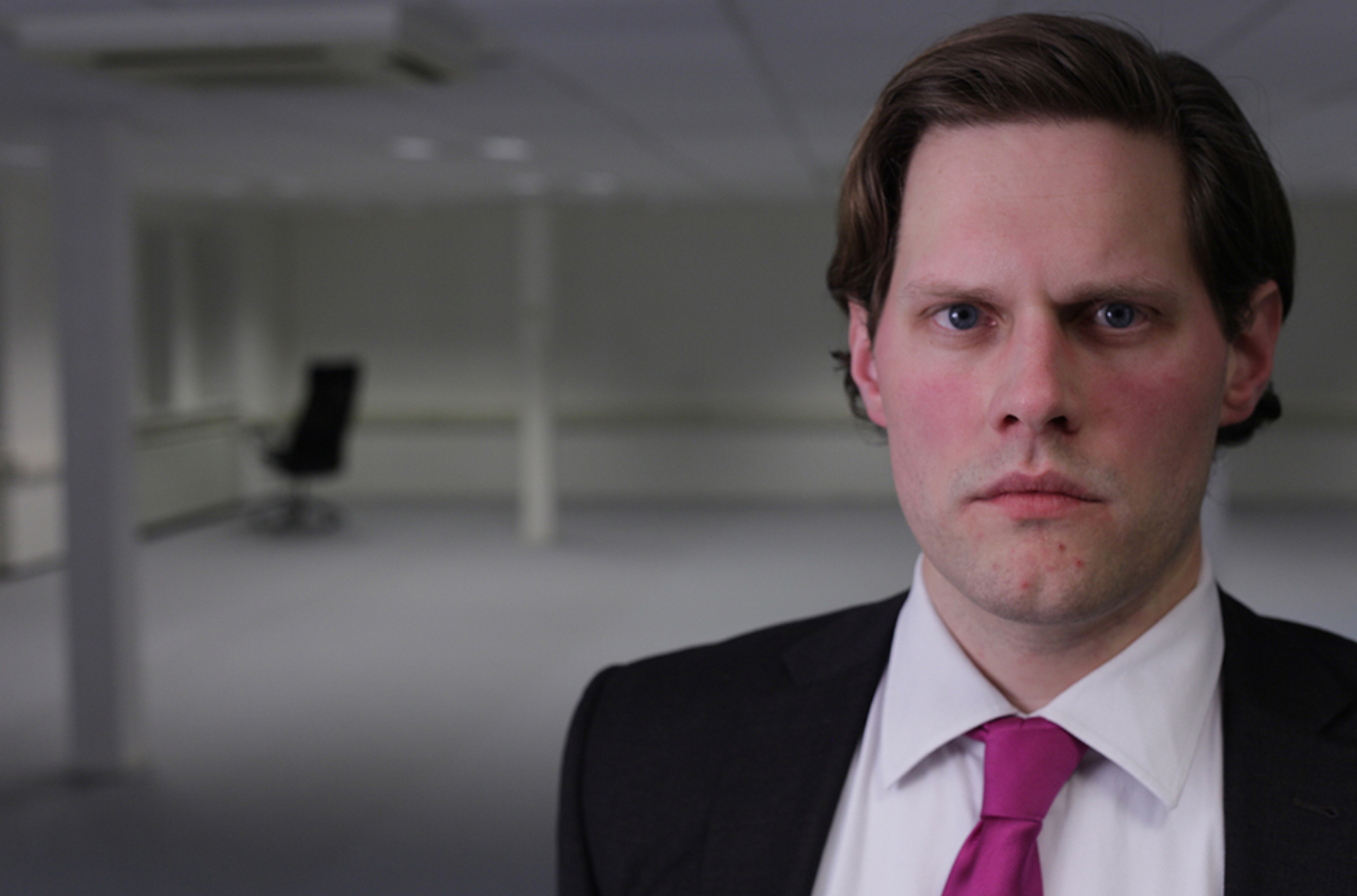 character looking straight into the camera in the space the video takes place